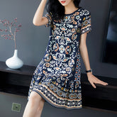 Vestido de manga corto de seda estampada con dobladillo con volantes